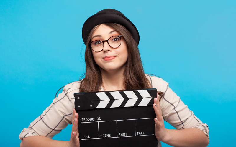 woman with clapperboard