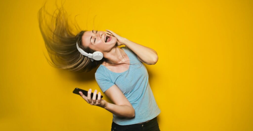girl singing with headphones